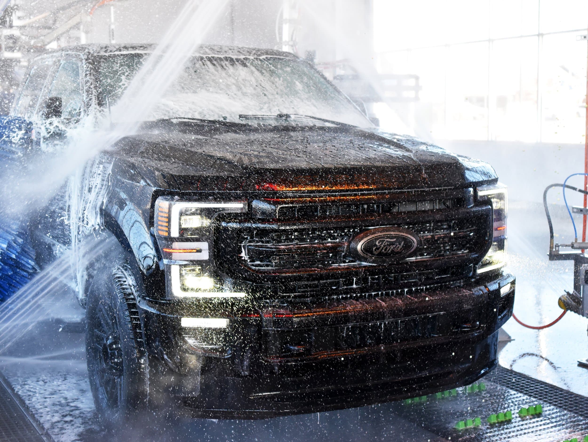 A truck moving through the Turbo Wash tunnel